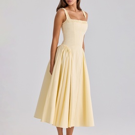 Model wearing House of CB lemon midi dress with square neckline, wide straps, fitted bodice and full pleated skirt