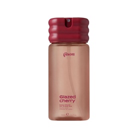 Gisou Glazed Cherry Body Mist in a pink-toned bottle with deep red spray cap