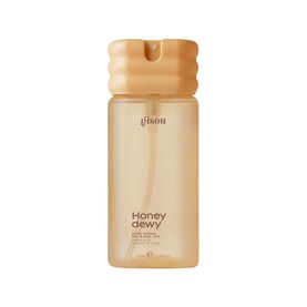 Gisou Honey Dewy Body Mist in a honey-gold translucent bottle with textured amber cap