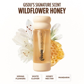Gisou Wildflower Honey Hair Oil in amber glass bottle with floral and honeycomb backdrop, notes of spring flowers, white clover, honey nectar,