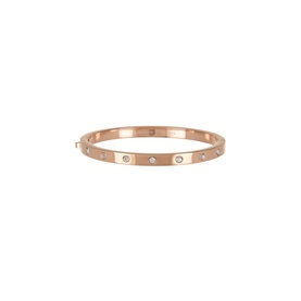Kate Spade clear/rose gold-tone bangle with evenly spaced crystal embellishments on plated metal band