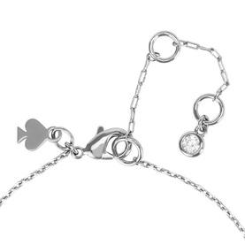 Kate Spade silver-tone necklace close-up showing lobster clasp, heart charm, paperclip chain extender and single crystal drop detail