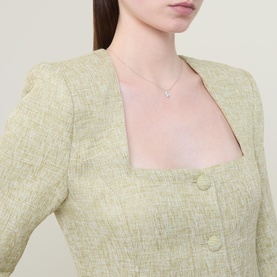 Model with Kate Spade Spade Flower Pav&eacute; Mini Pendant Necklace, silver-tone dainty chain with cubic zirconia Spade Flower pendant, styled with green