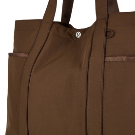 Lululemon tote bag in Walnut Crunch, structured design with double top handles, side pocket, and logo badge detail.