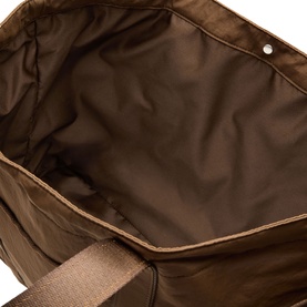 Lululemon bag in Walnut Crunch, interior view showing brown fabric lining and silver stud detail with structured sides.
