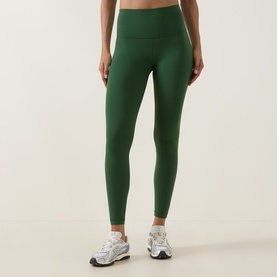 Model wearing Lululemon leggings in Ivy Grove, high-waisted silhouette, styled with white chunky trainers