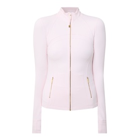 Lululemon jacket in Pink Pearl with gold zip fastening, zip pockets, mock neck collar and fitted silhouette.