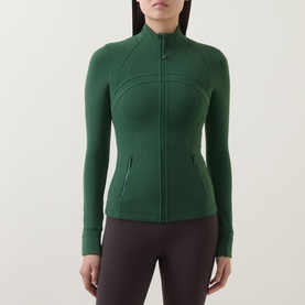 Model wearing Lululemon Ivy Grove zip-up fitted jacket with ribbed panels and side pockets, styled with dark leggings.