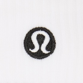 Lululemon Daily Essential Stripe Crew Socks in white, close-up of embroidered black logo detail