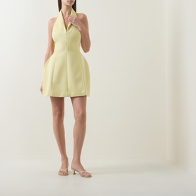 Model wearing Odd Muse Shawl Zip Sculpted Mini Dress in lemon, featuring V-neckline, shawl collar and structured silhouette, styled with nude heels.
