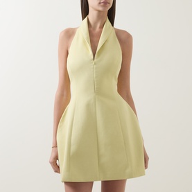 Model wearing Odd Muse Shawl Zip Sculpted Mini Dress in lemon with shawl collar, V-neckline, front zip, and structured flared skirt.