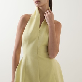 Model wearing Odd Muse Shawl Zip Sculpted Mini Dress in Lemon, featuring shawl collar, V-neckline, sleeveless structured silhouette