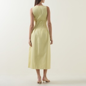 Model wearing Odd Muse Cinched Pleated Dress in Lemon, showing rear view of sleeveless midi silhouette with cinched waist and pleated skirt.