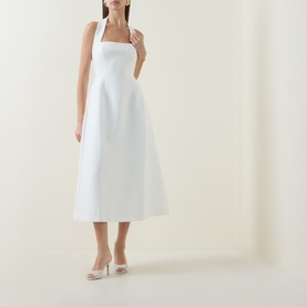 Model wearing Odd Muse Cinched Halter Dress in white, midi length with structured bodice and cinched waist, styled with nude heels