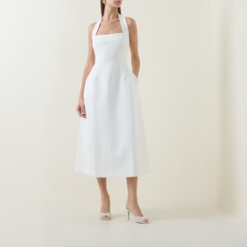 Model wearing Odd Muse Cinched Halter Dress in white, featuring halter neck, structured bodice, cinched waist and midi-length skirt, styled with