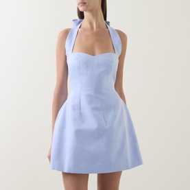 Model wearing Odd Muse Pinstripe Tie-Neck Mini Dress in blue pinstripe, featuring halter bow neck, sweetheart bodice and A-line mini skirt