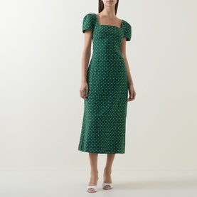 Model wearing Odd Muse Polka Dot Slip Dress in green polka dot, midi length, square neckline, short puff sleeves, styled with white mule heels.