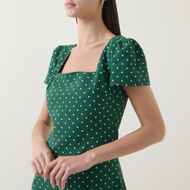 Model wearing Odd Muse Polka Dot Slip Dress in Green Polka Dot, featuring square neckline and short puff sleeves.