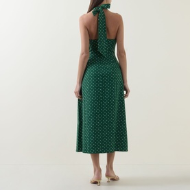 Model wearing Odd Muse Volume Polka Dot Tie-Neck Dress in green polka dot, showing open back, neck tie, cinched waist and midi-length flared skirt.