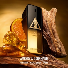 Paco Rabanne 1 Million Night Elixir Parfum black and gold bottle styled with orange slices and amber resin, with Ambery & Gourmand fragrance notes