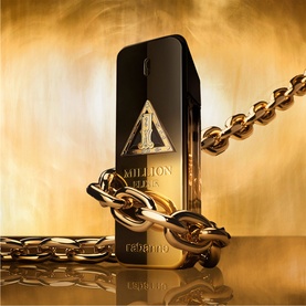 Paco Rabanne 1 Million Night Elixir Parfum in black and gold bottle, wrapped in chunky gold chain on golden background