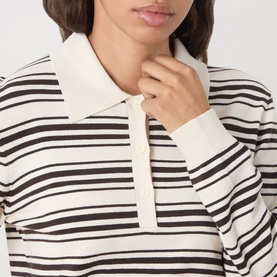 Model wearing Part Two Mole Stripe knit polo top with horizontal brown and cream stripes and ribbed collar and cuffs.