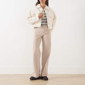 Model wearing Part Two Mole Stripe knitwear, styled with cream denim jacket, stone wide-leg trousers and black loafers.