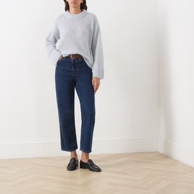 Model wearing Part Two Gray Dawn mohair blend crew neck jumper, styled with dark blue straight-leg jeans, brown belt and black loafers