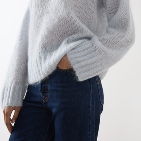 Model wearing Part Two Gray Dawn mohair blend knit sweater, styled with dark blue denim jeans. Cropped relaxed fit, fine-knit texture.