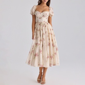Model wearing House of CB Ivory Vintage Rose floral midi dress with puff sleeves, sweetheart neckline and full pleated skirt.