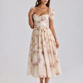 Model wearing House of CB Ivory Vintage Rose floral midi dress with puff sleeves, sweetheart neckline and full pleated skirt