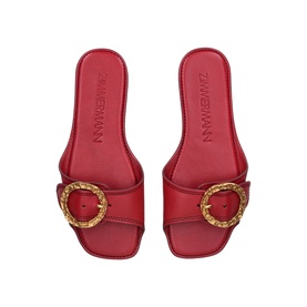 Zimmermann red leather flat mules with oversized gold-tone ornate buckle detail, square open toe, shot from above