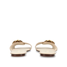 Zimmermann white flat mule sandals, rear view, featuring gold double-ring hardware detail and tan leather insole.