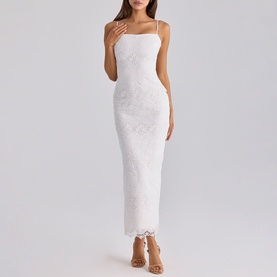 Model wearing House of CB white lace maxi dress with spaghetti straps, fitted silhouette, and scalloped hem detail