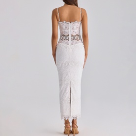 Model wearing House of CB white lace midi dress with sheer corset bodice, spaghetti straps, and back split, shown from behind