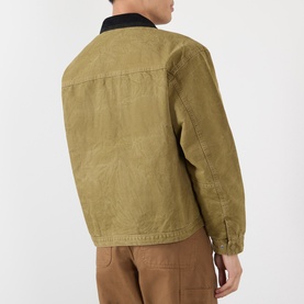 Model wearing Vans brown cotton casual jacket, back view, with black collar and tan trousers visible.