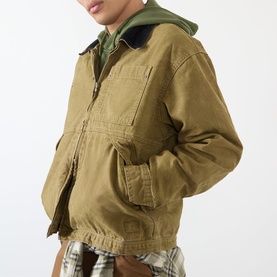 Model wearing Vans brown cotton casual jacket with chest pockets and zip fastening, styled with green hoodie and plaid shirt