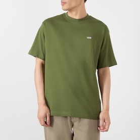 Model wearing Vans green crew neck T-shirt with small chest logo, styled with beige trousers. 100% cotton.