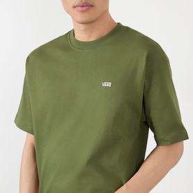 Model wearing Vans green oversized cotton T-shirt with small white logo embroidered on left chest