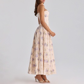 Model wearing cream floral print sleeveless midi dress with sweetheart neckline and full gathered skirt, side profile view