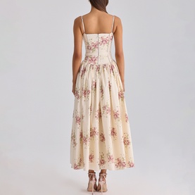 Model wearing House of CB Ivory Vintage Rose floral midi dress with spaghetti straps, ruched bodice and full skirt, back view