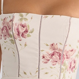 Model wearing House of CB Ivory Vintage Rose corset top with floral print and contrast stitch boning detail.