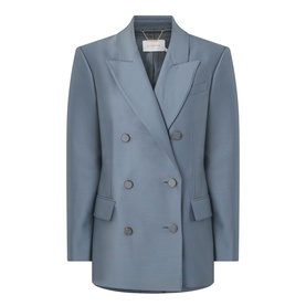 Dusty blue double-breasted blazer with peak lapels, six front buttons, and a relaxed silhouette