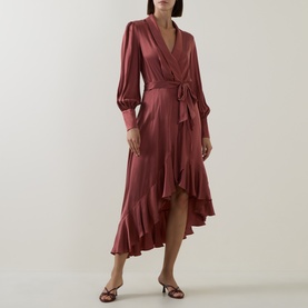 Model wearing Zimmermann Blush Rose silk wrap midi dress with long puffed sleeves, ruffle hem, and tie waist belt, styled with strappy heels.