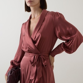 Model wearing Zimmermann Blush Rose silk wrap dress with V-neckline, balloon sleeves, and tie waist belt.
