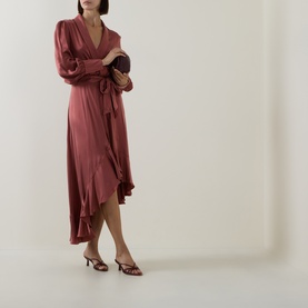 Model wearing Zimmermann Blush Rose silk wrap midi dress with long sleeves, ruffle hem, styled with strappy heels and a small clutch bag.