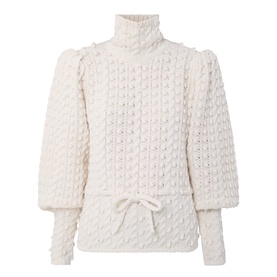 Zimmermann Bubble Textured Turtleneck Sweater in cream with puff shoulders, blouson sleeves, front tie, and bubble-knit finish