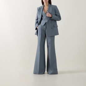 Model wearing Zimmermann Valiant Single-Breasted Waistcoat in Airforce, styled with matching wide-leg trousers and blazer.