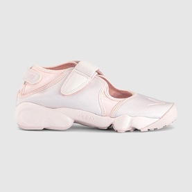 Nike Air Rift trainer in pale pink, split-toe design with velcro strap and chunky pink sole, leather upper