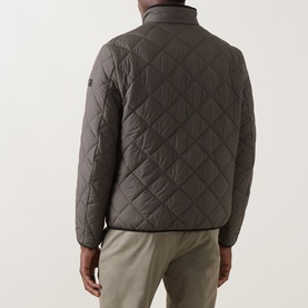 Model wearing Bugatti Air Series Diamond Quilted Jacket in olive, showing rear view with diamond quilted finish, stand-up collar and logo badge on